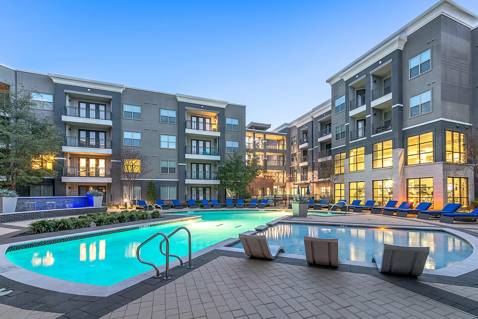 AREIT owned apartment building with a large swimming pool